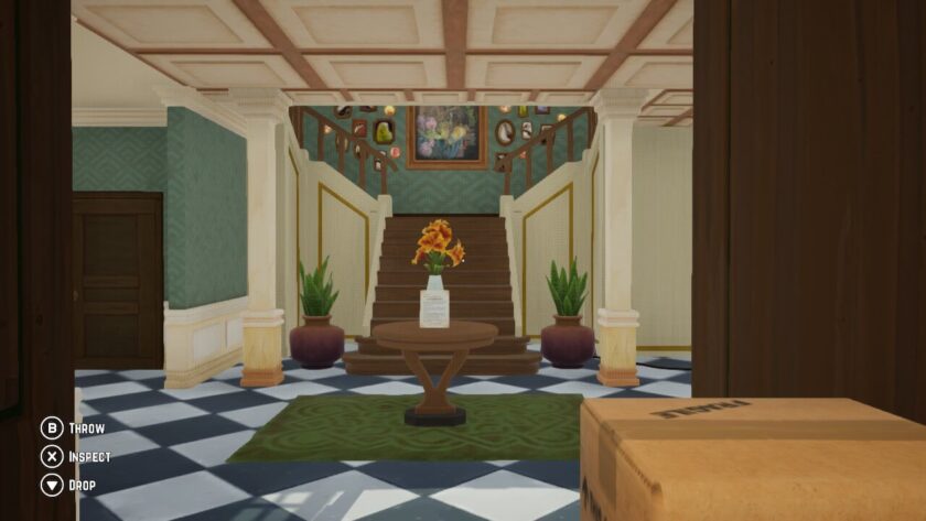 Circular table with a vase of yellow flowers. There is a note propped against the vase. Published on LadiesGamers