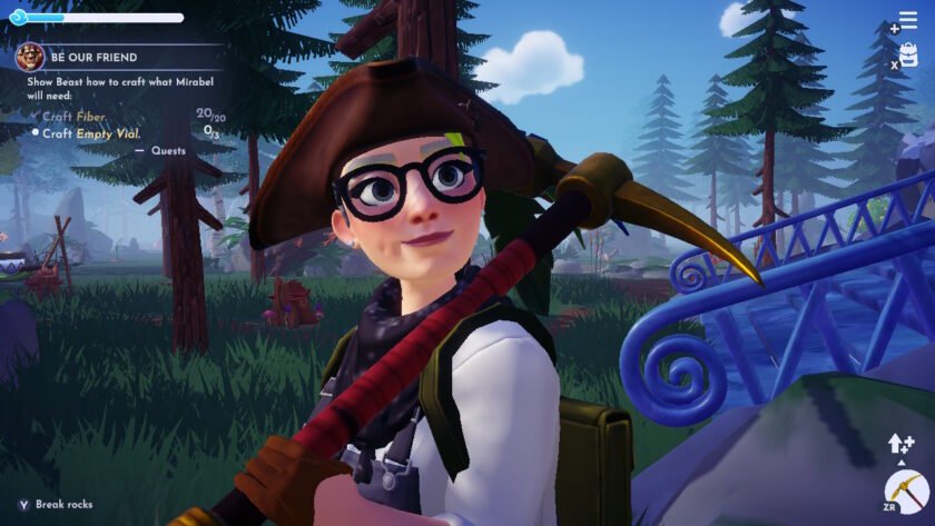 Head and torso of a human woman, wearing glasses and overalls, holding a pickaxe over her shoulder. Evergreen trees are scattered in the land behind her, the sky is blue with puffy white clouds.