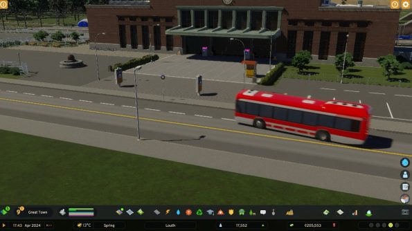 a red bus driving in the city