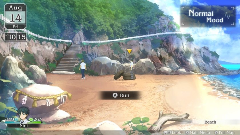 Nini is standing near the tires at the beach