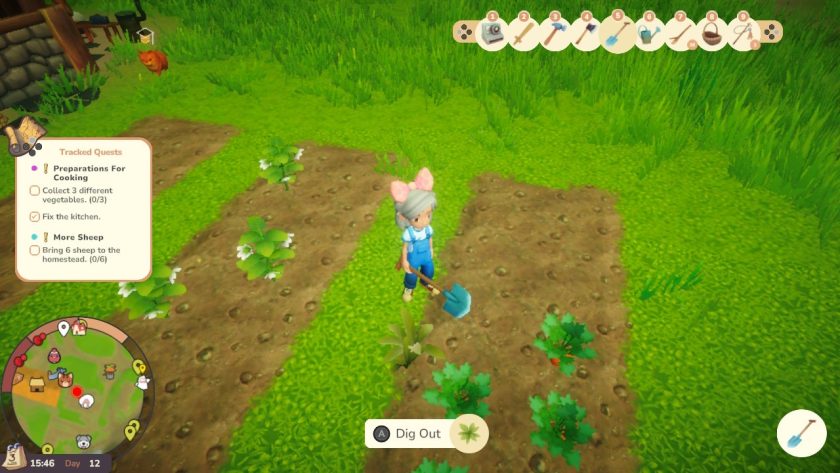 Yvocaro in front of the veggie patches looking at a weed