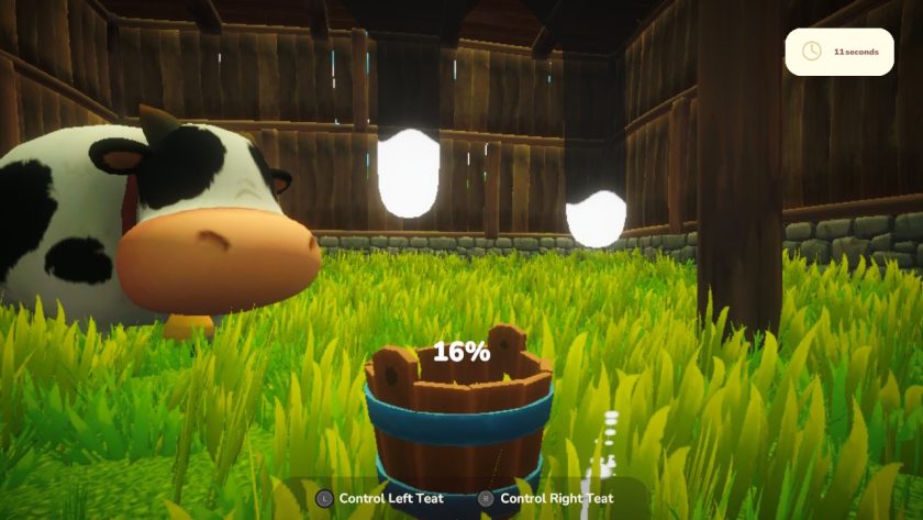 The mini game for milking the cow shows two teats and a bucket