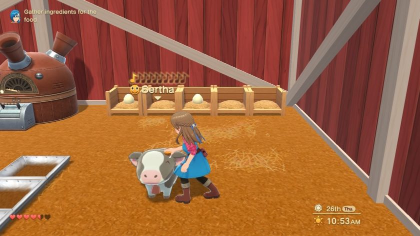 The games protagonist is taking care of her cow in the barn
