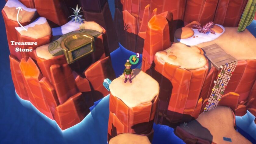 The character standing on a rock stack with a wind spinner below. The treasure stone location is marked going up the mountain. Published on: LadiesGamers